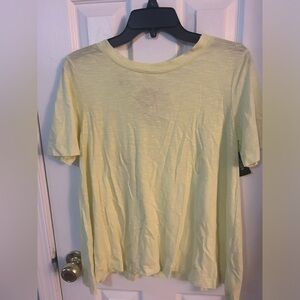 Lisa Todd yellow short sleeve tee shirt with multi rope keyhole neck in back.